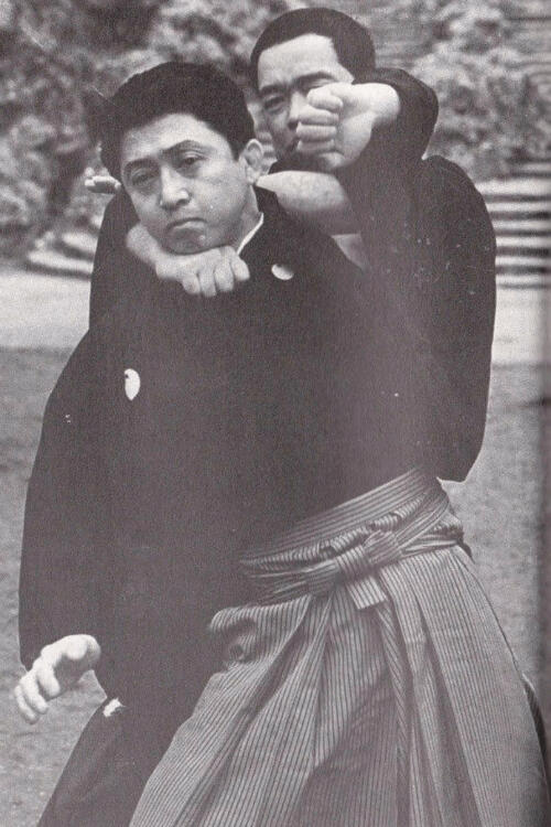 Soke Yasumoto holding an attacker in a choke